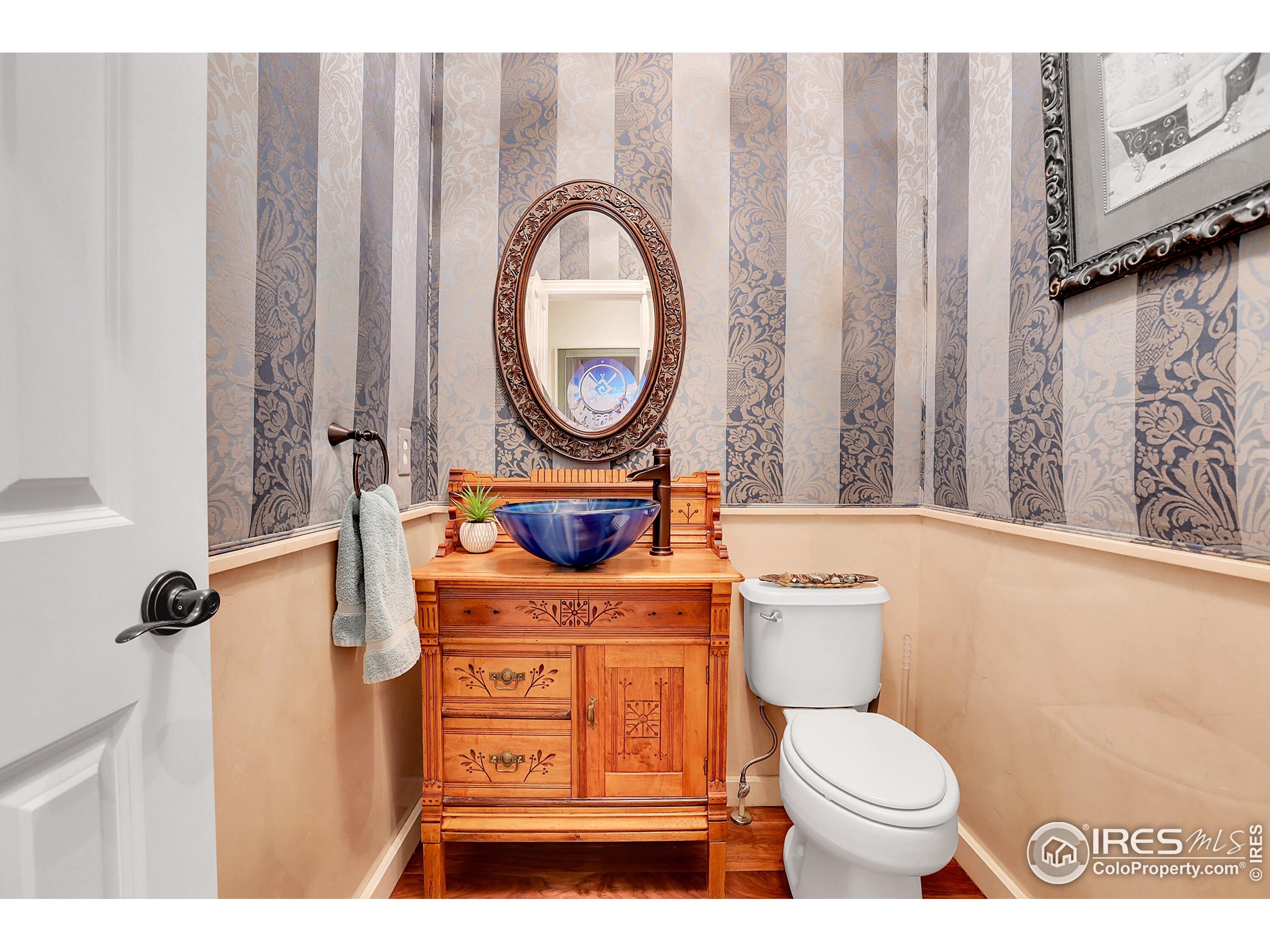 112 Austin Avenue Erie, CO 80516 - Photo 41 of 44 a bathroom with a toilet a sink and a mirror