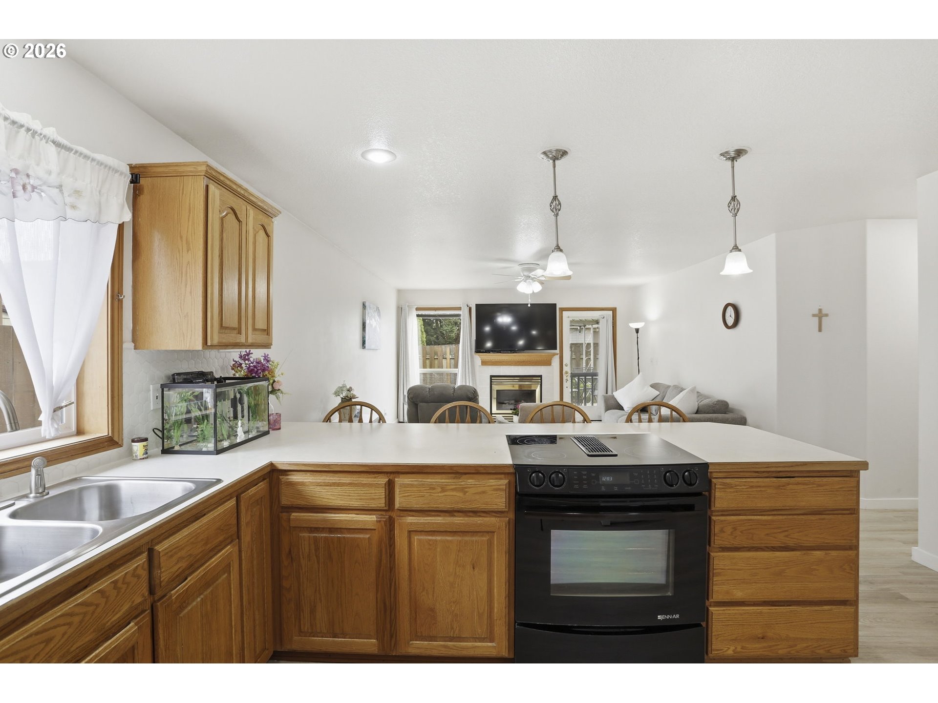 858 Southwest 24th Street Troutdale, OR 97060 - Photo 12 of 32 a kitchen with kitchen island granite countertop a sink and cabinets