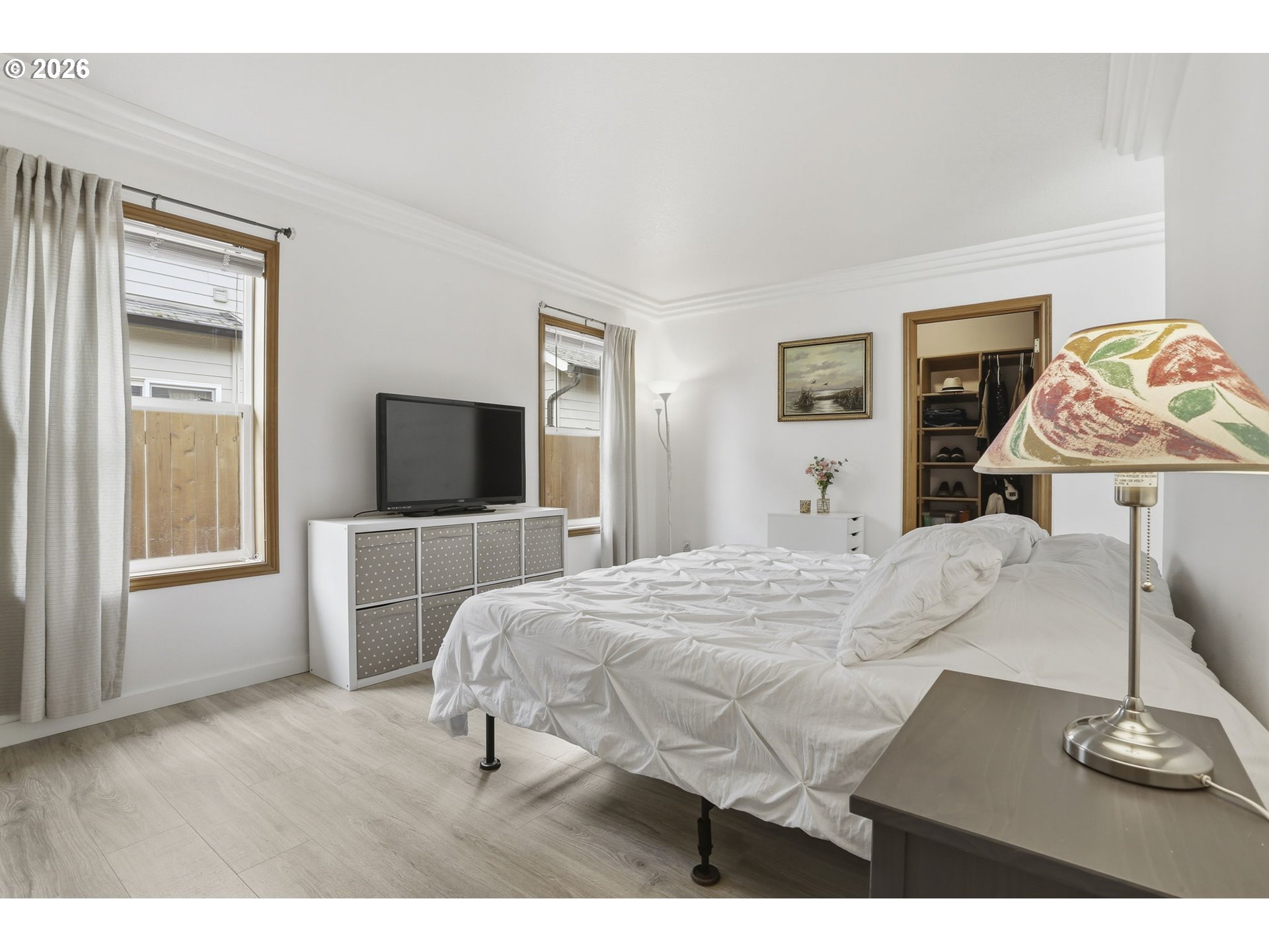 858 Southwest 24th Street Troutdale, OR 97060 - Photo 16 of 32 a bedroom with a bed and wooden floor