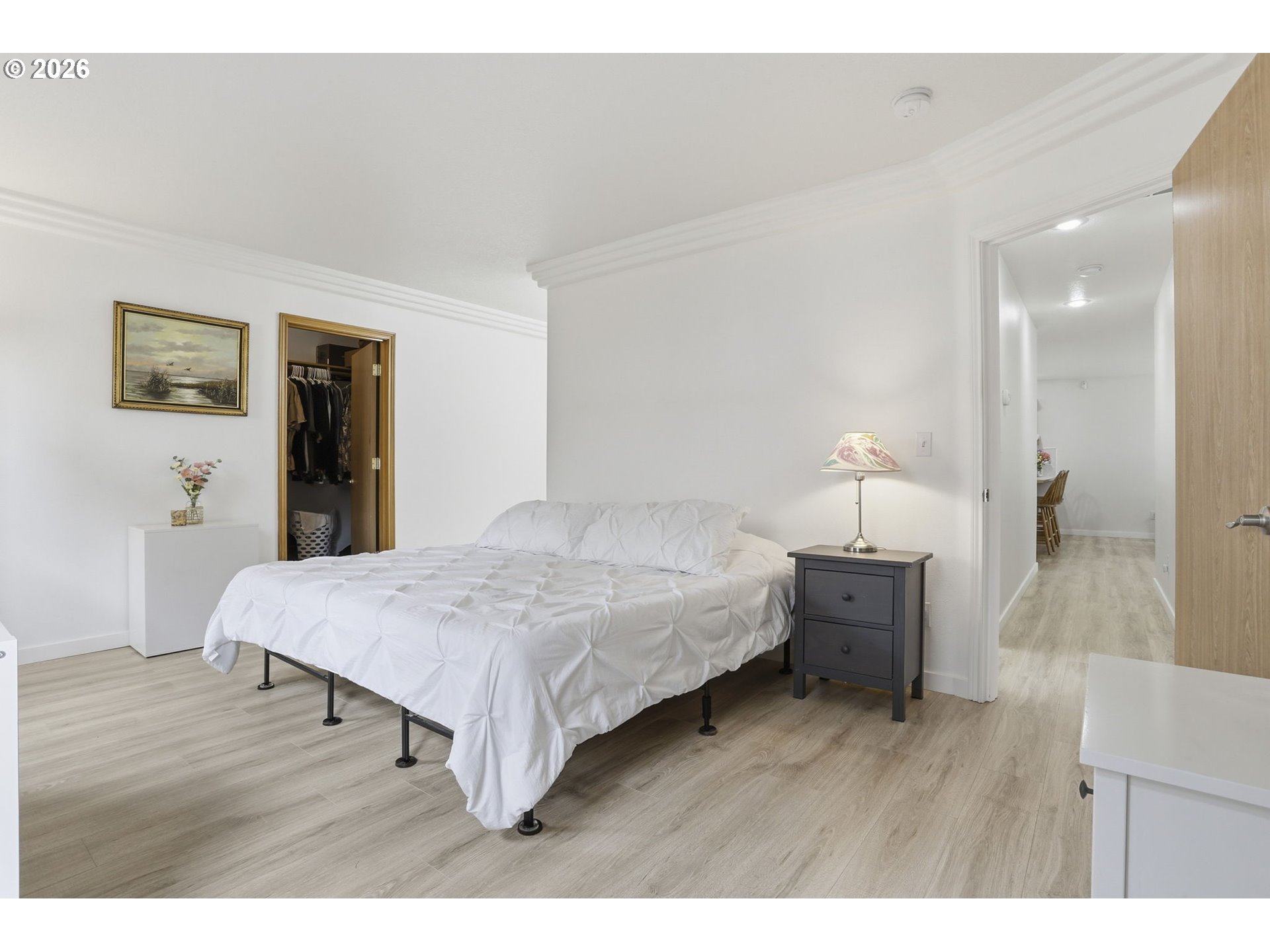 858 Southwest 24th Street Troutdale, OR 97060 - Photo 17 of 32 a spacious bedroom with a bed and wooden floor