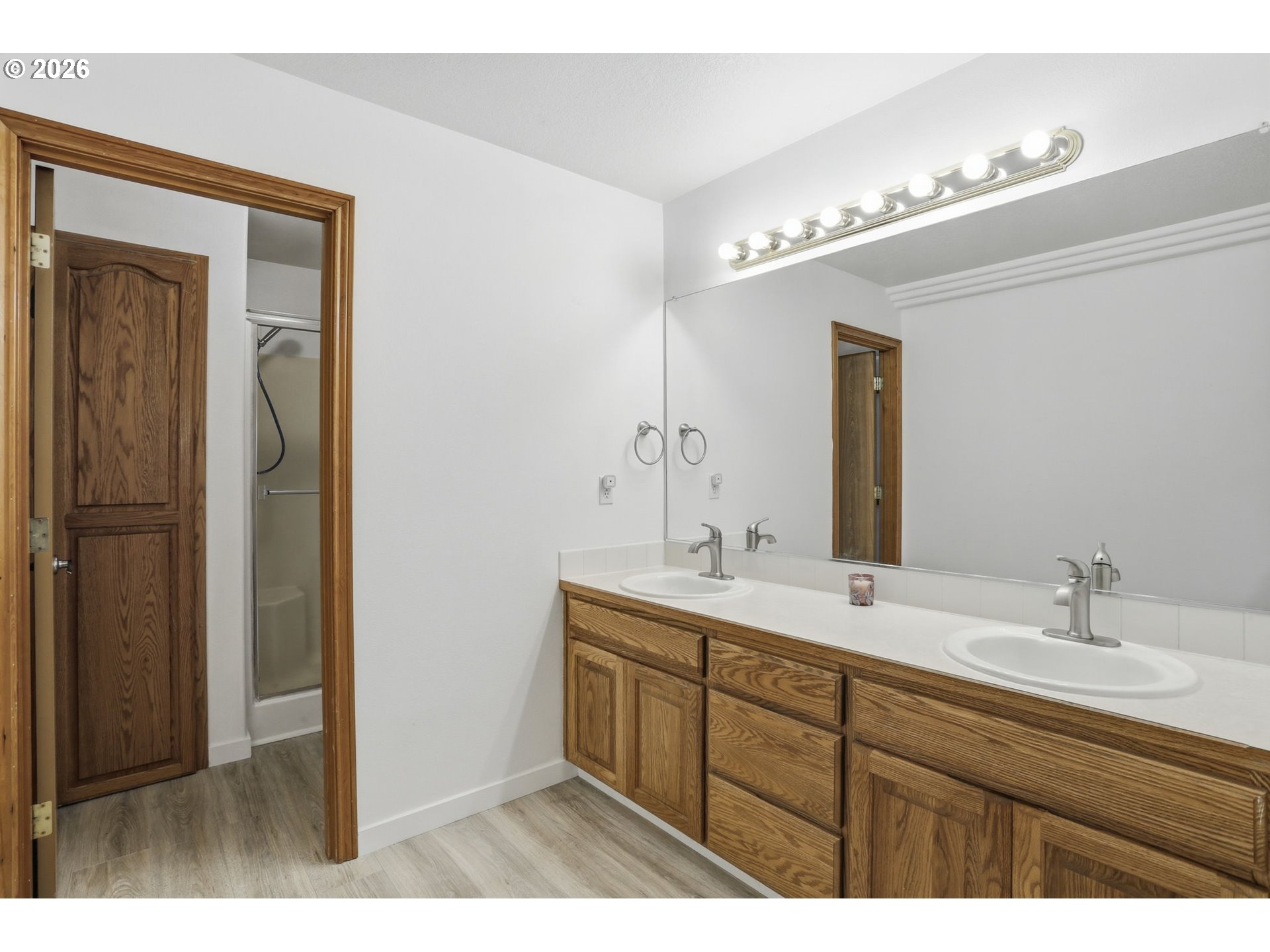 858 Southwest 24th Street Troutdale, OR 97060 - Photo 18 of 32 a bathroom with a double vanity sink and mirror