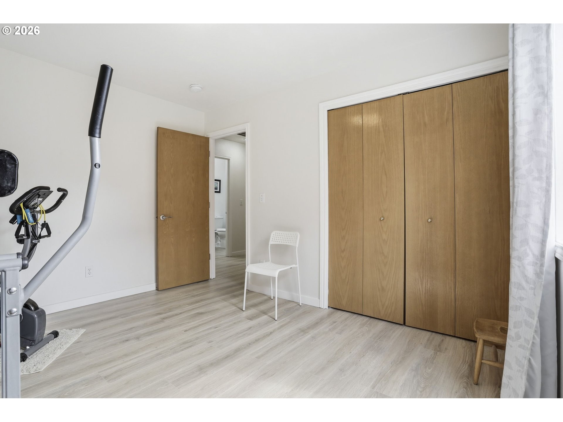 858 Southwest 24th Street Troutdale, OR 97060 - Photo 21 of 32 a view of an empty room with wooden floor