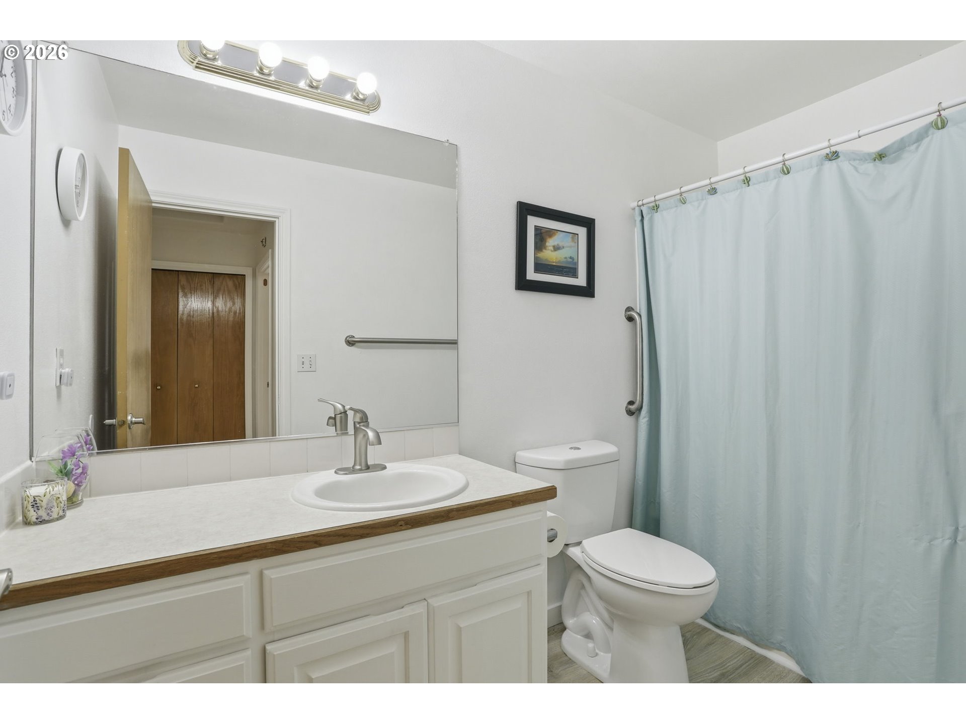 858 Southwest 24th Street Troutdale, OR 97060 - Photo 22 of 32 a bathroom with a sink vanity mirror and toilet