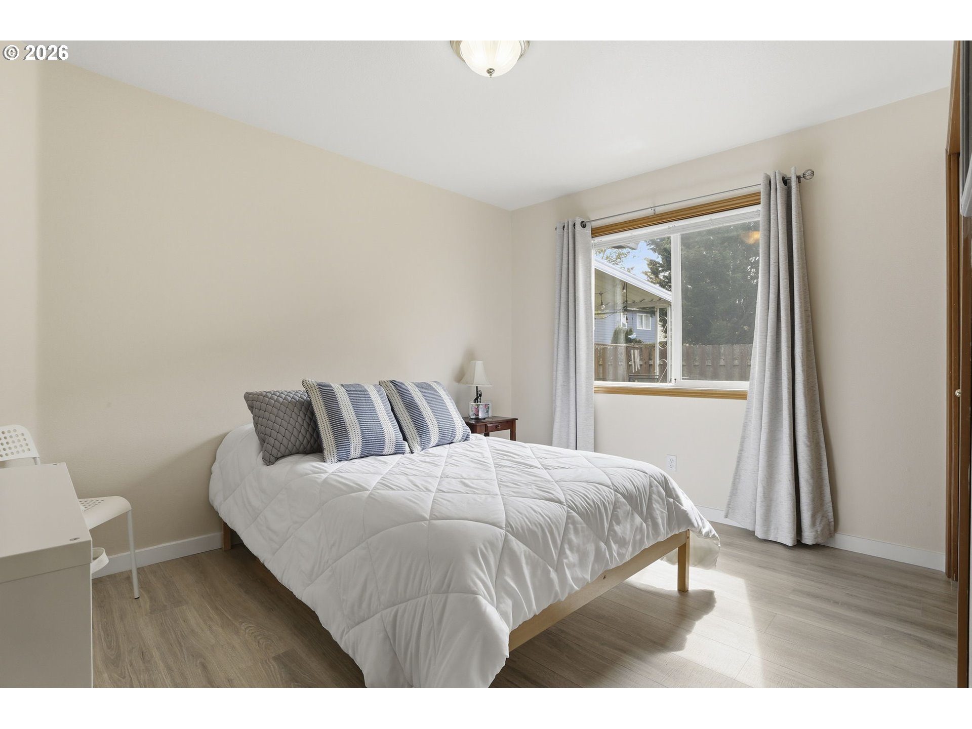 858 Southwest 24th Street Troutdale, OR 97060 - Photo 23 of 32 a bedroom with a bed and wooden floor