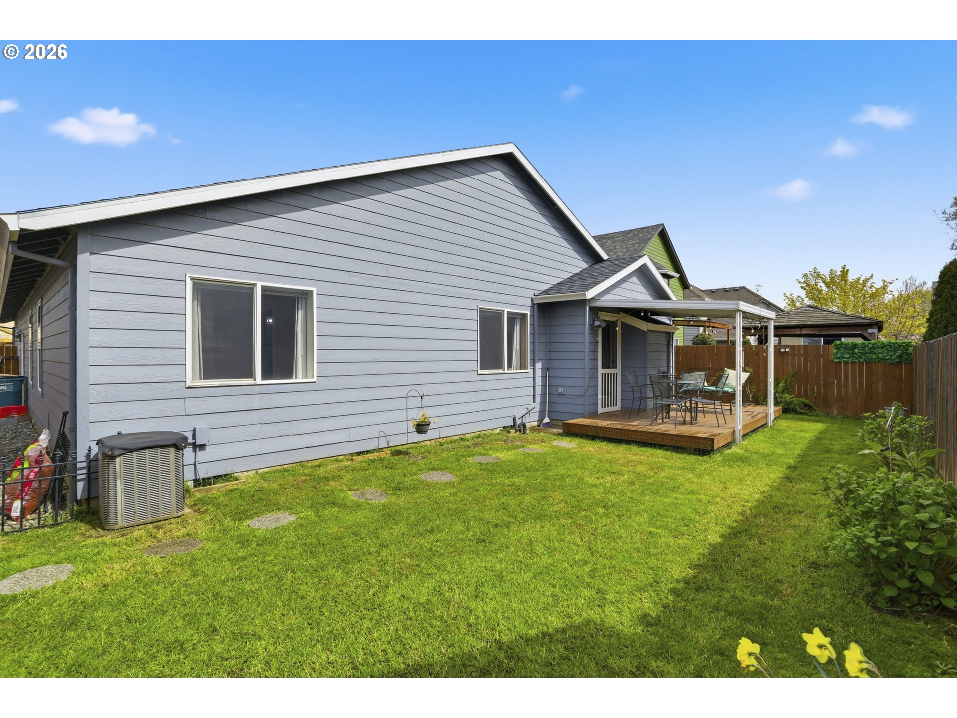 858 Southwest 24th Street Troutdale, OR 97060 - Photo 27 of 32 a backyard of a house with table and chairs