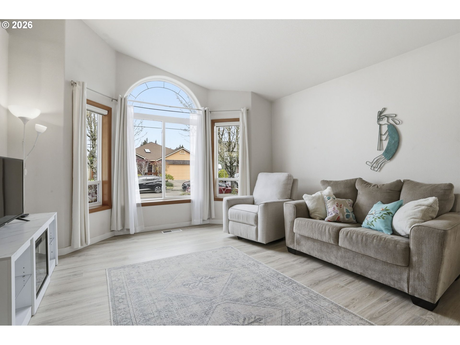858 Southwest 24th Street Troutdale, OR 97060 - Photo 6 of 32 a living room with furniture and a flat screen tv