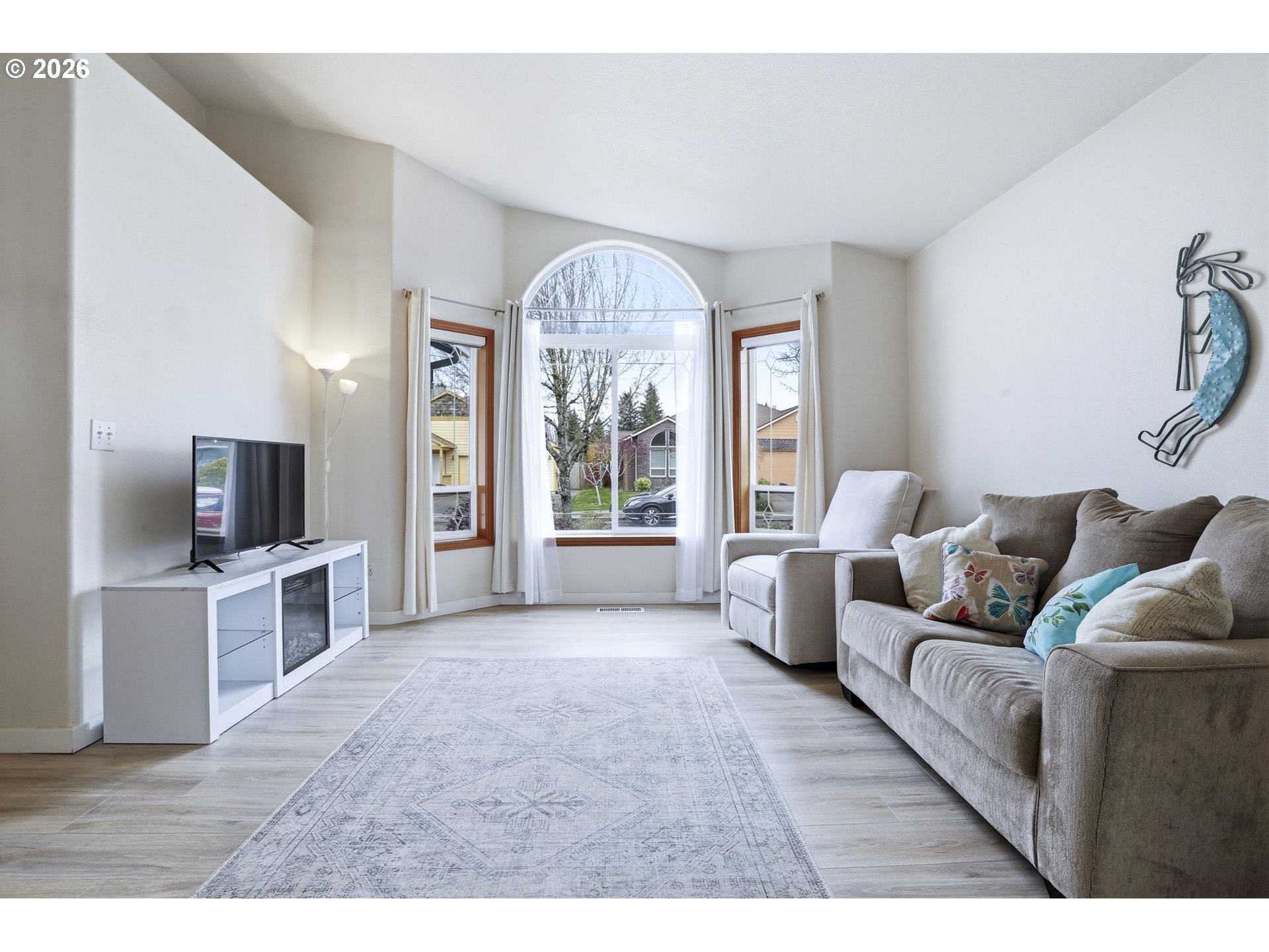858 Southwest 24th Street Troutdale, OR 97060 - Photo 7 of 32 a living room with furniture and a flat screen tv