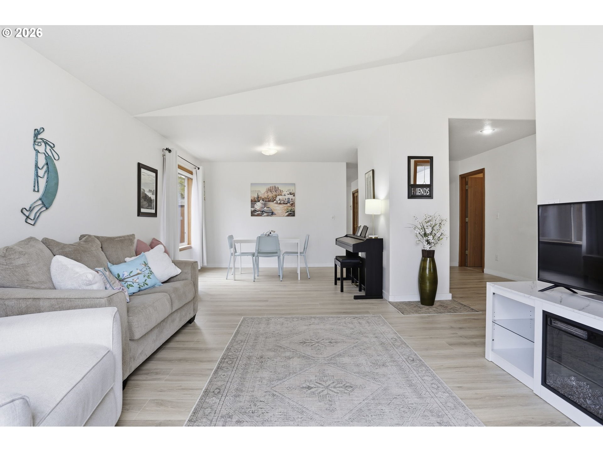 858 Southwest 24th Street Troutdale, OR 97060 - Photo 9 of 32 a living room with furniture and a flat screen tv