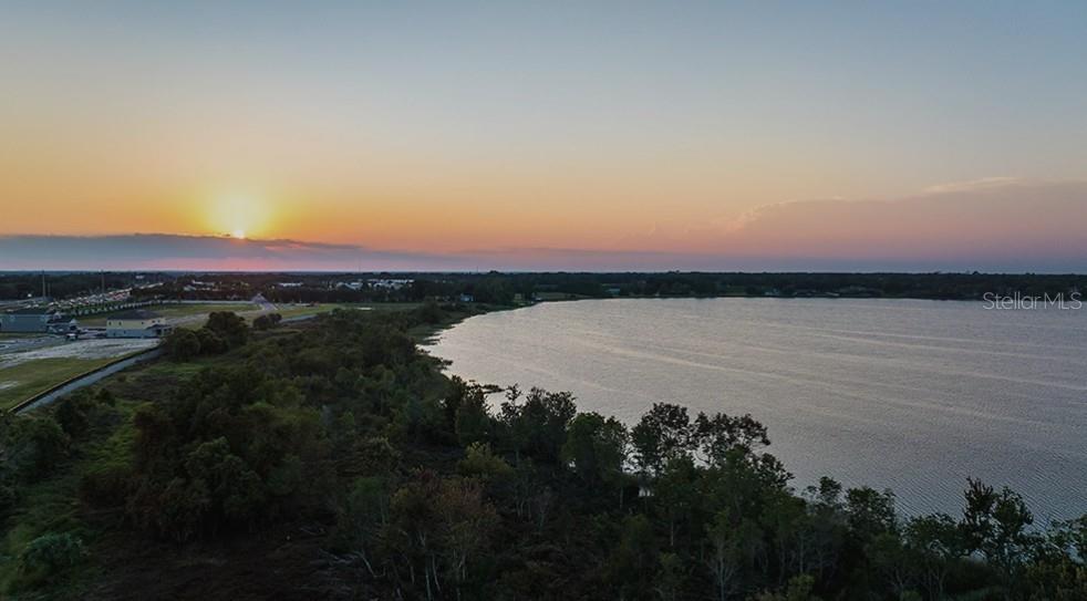 19305 Lochside Ln Mount Mount Dora, FL 32757 - Photo 5 of 5 a view of a lake and sunset