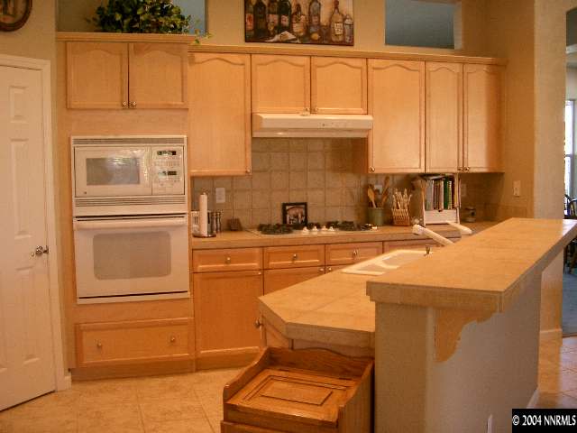 440 Octate Circle Reno, NV 89511 - Photo 2 of 8 a kitchen with a refrigerator and a sink