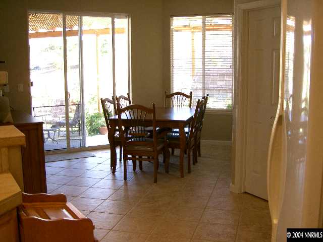 440 Octate Circle Reno, NV 89511 - Photo 4 of 8 a view of a dining room with furniture window and outside view