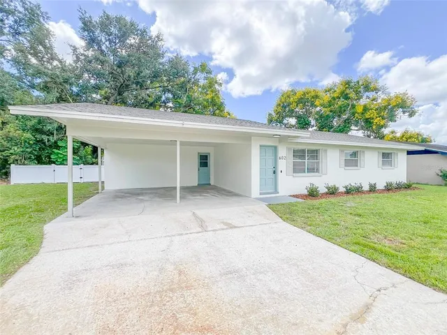 front view of a house and a yard
