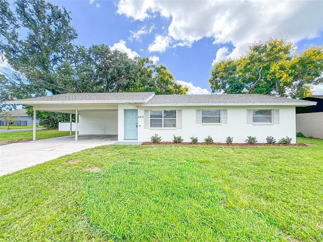 front view of a house with a garden
