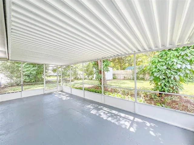 a view of a garden with an outdoor seating