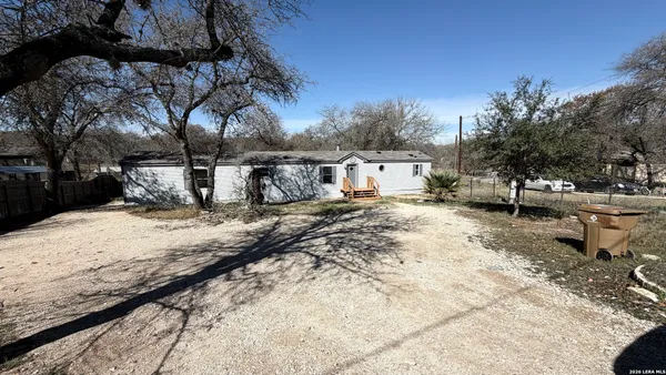 a view of a backyard of the house