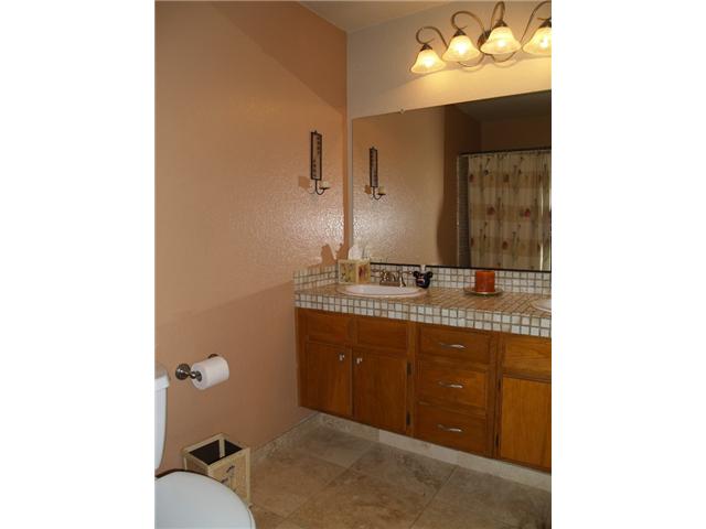 2095 Wandering Road Encinitas, CA 92024 - Photo 14 of 22 Secondary bath has dual sinks, stone floors and newer fixtures