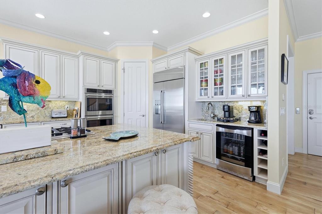 131 South Gulf Boulevard Boca Grande, FL 33921 - Photo 18 of 59 a kitchen with stainless steel appliances granite countertop a stove refrigerator and cabinets