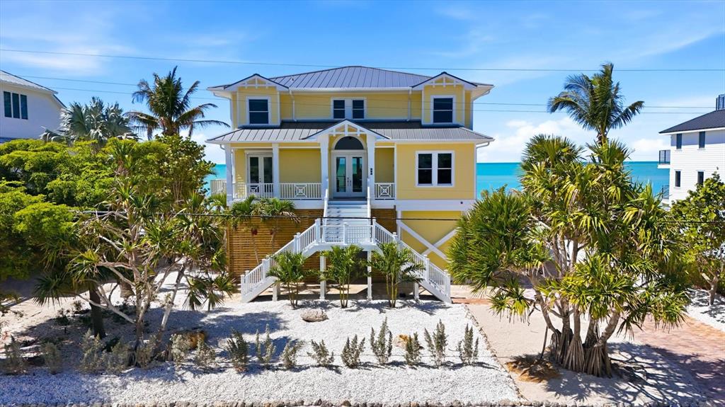 131 South Gulf Boulevard Boca Grande, FL 33921 - Photo 2 of 59 a front view of a house with a yard