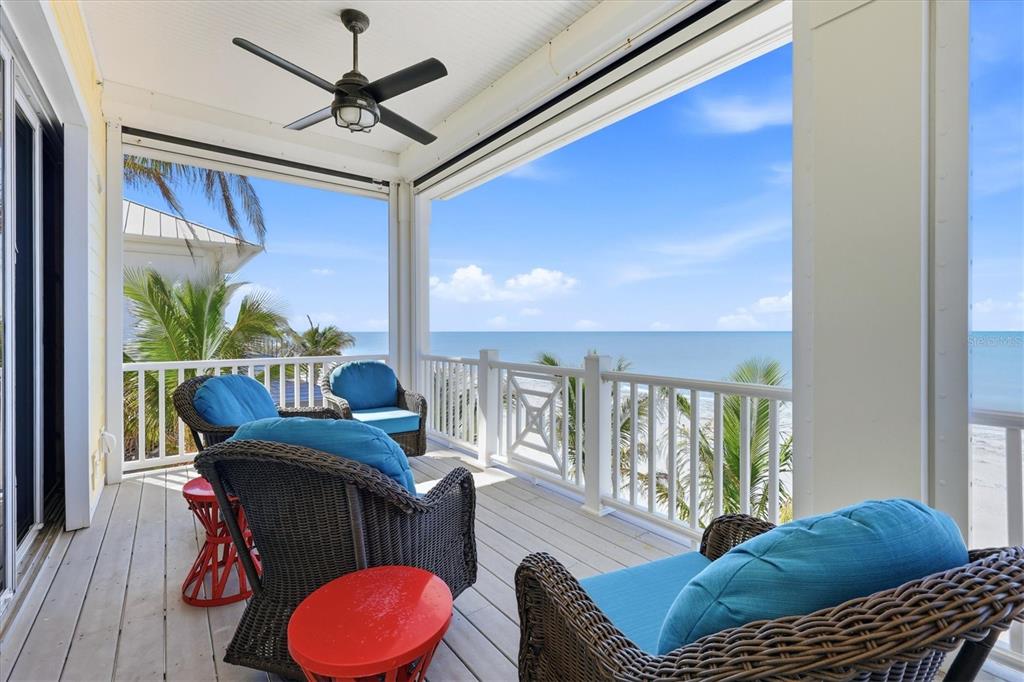131 South Gulf Boulevard Boca Grande, FL 33921 - Photo 44 of 59 a living room with furniture and a floor to ceiling window
