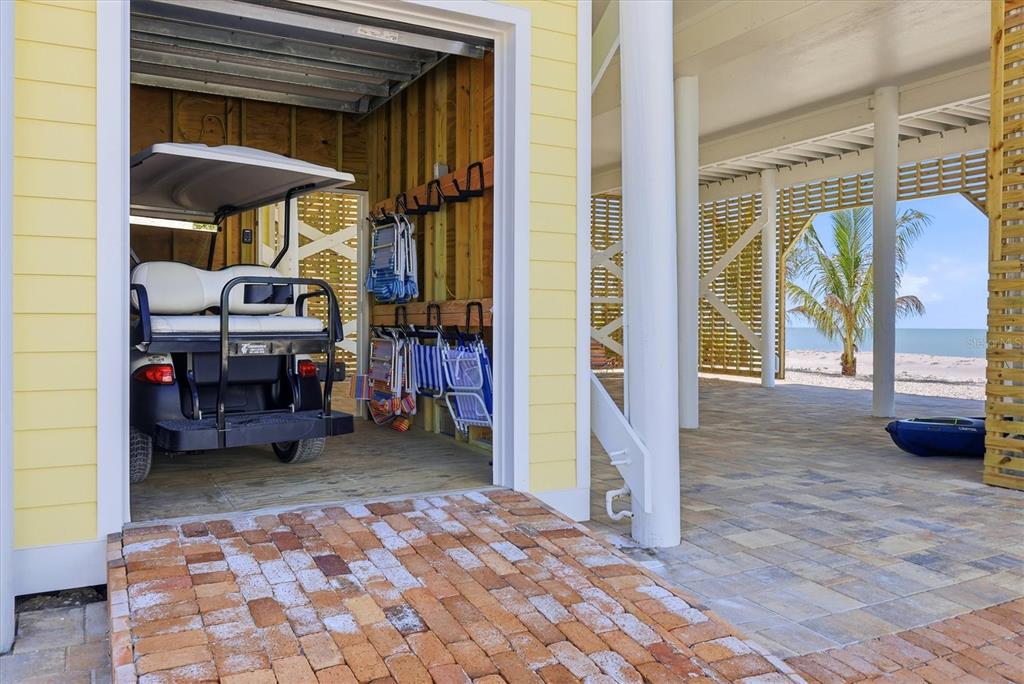 131 South Gulf Boulevard Boca Grande, FL 33921 - Photo 47 of 59 a view of a patio with table and chairs under an umbrella