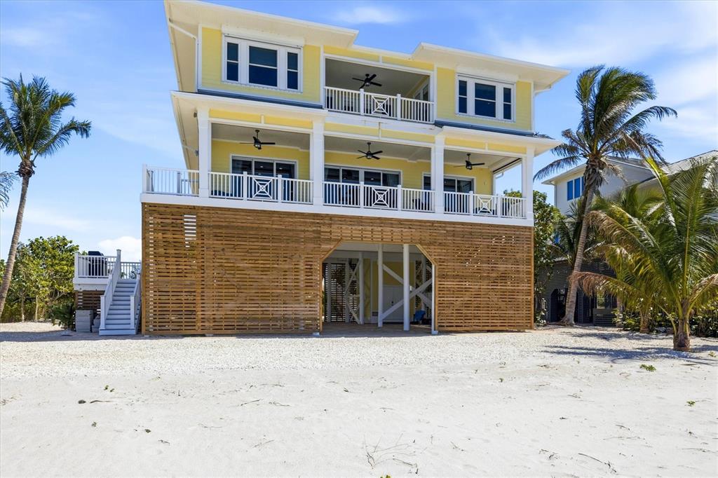 131 South Gulf Boulevard Boca Grande, FL 33921 - Photo 50 of 59 a front view of a house with a yard