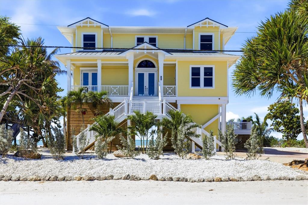 131 South Gulf Boulevard Boca Grande, FL 33921 - Photo 6 of 59 a front view of a house with garden
