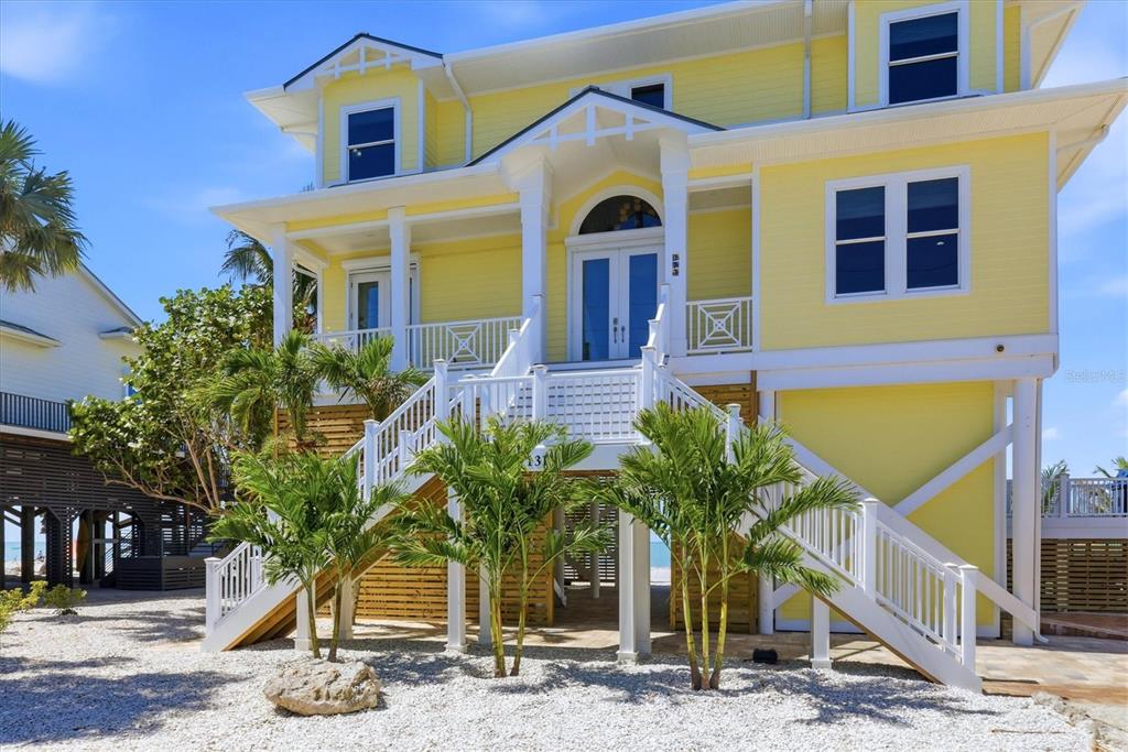 131 South Gulf Boulevard Boca Grande, FL 33921 - Photo 8 of 59 a front view of house with small garden
