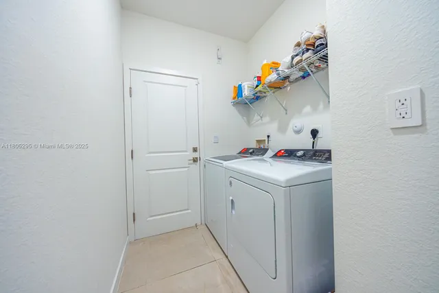 a living room with furniture and a dresser