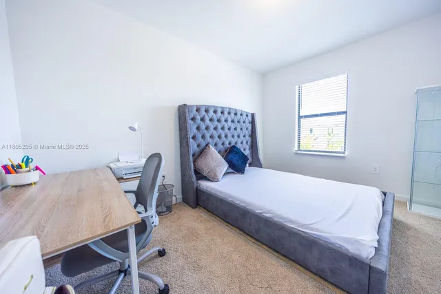 a bathroom with a sink mirror vanity and toilet