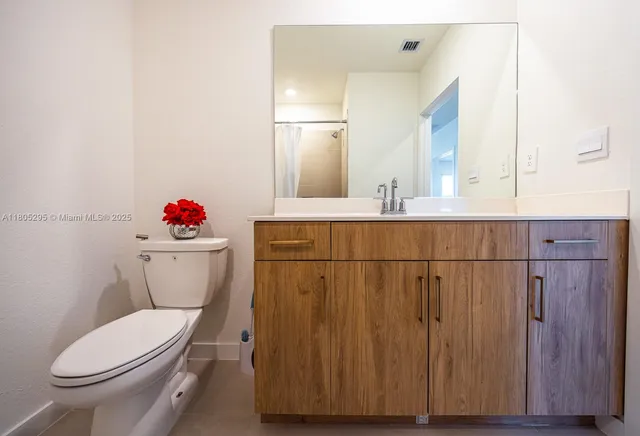 a living room with a couch and a window
