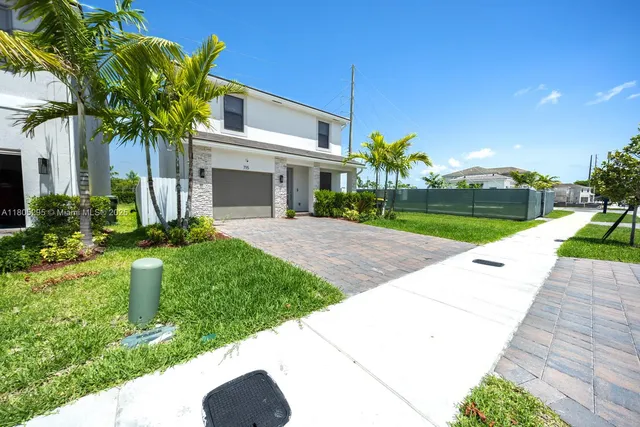 a swimming pool with outdoor seating and yard