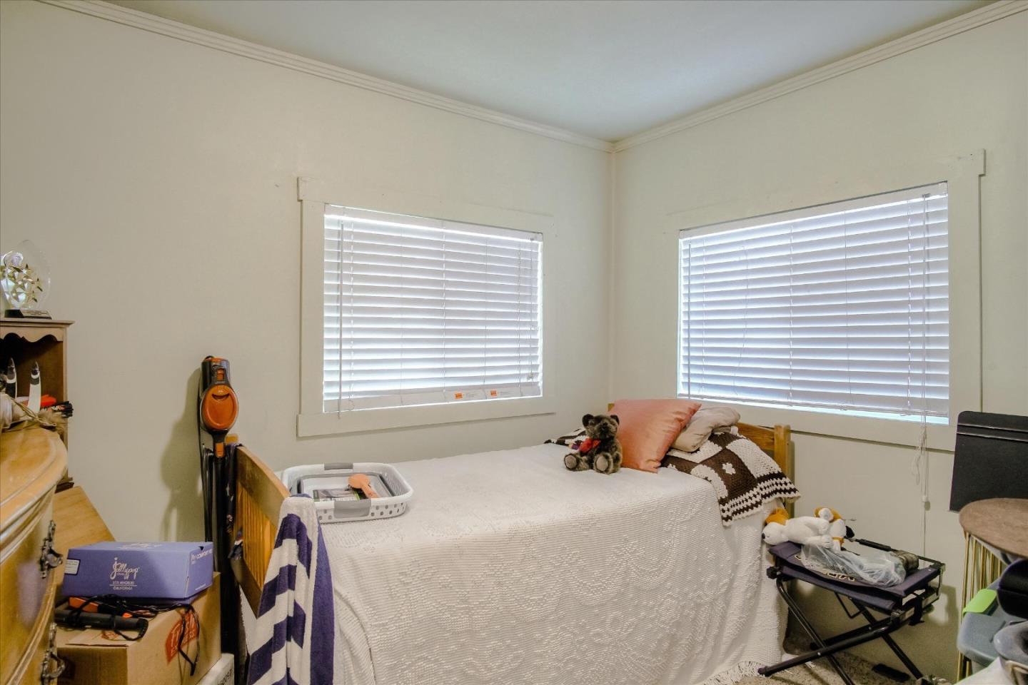 6520 Fairview Road Hollister, CA 95023 - Photo 17 of 39 a bed sitting in a bedroom next to a window