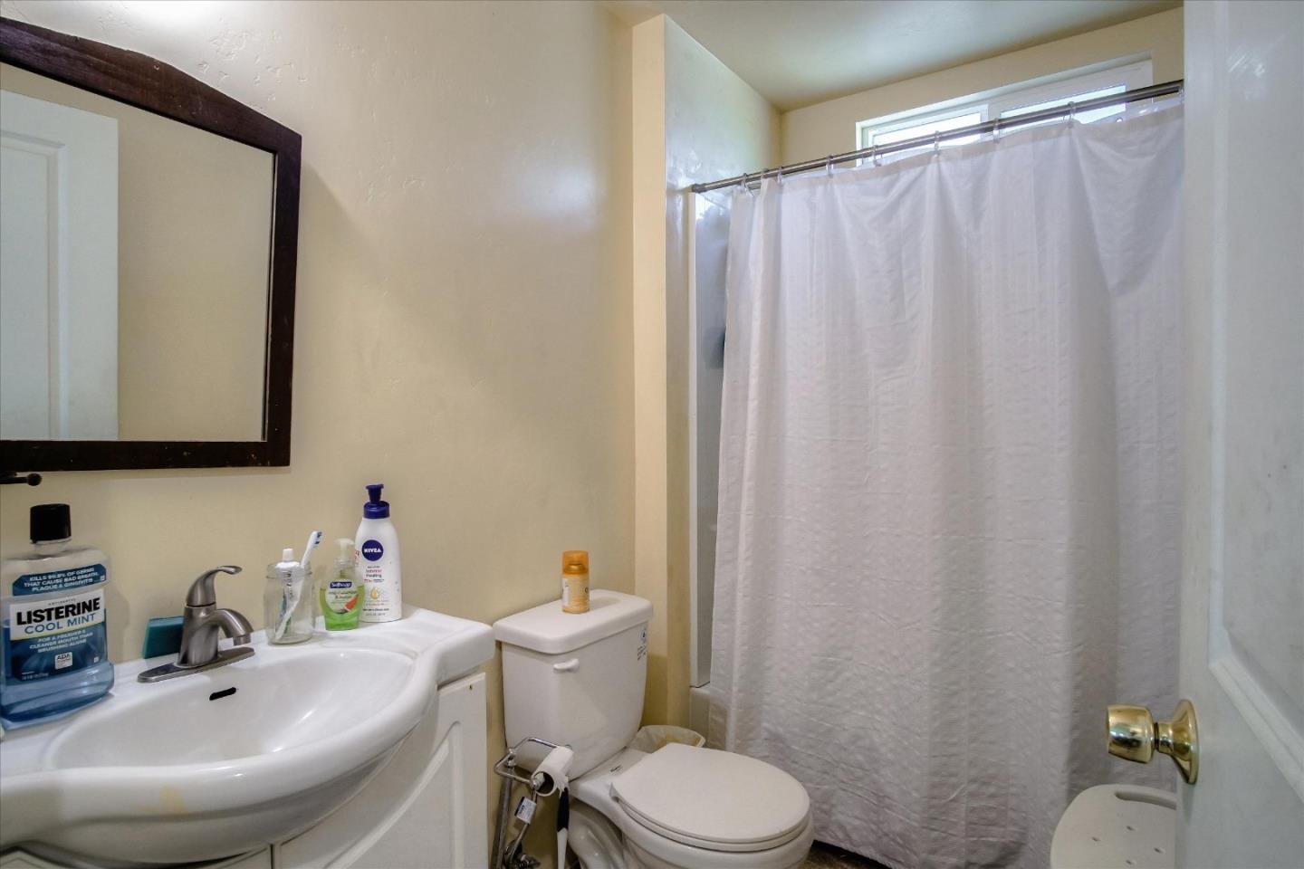 6520 Fairview Road Hollister, CA 95023 - Photo 18 of 39 a bathroom with a sink and a mirror