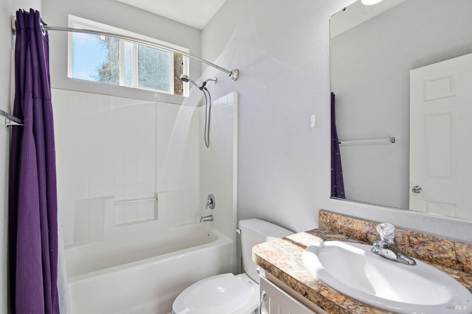 5501 Ranchito Way Santa Rosa, CA 95403 - Photo 16 of 20 a bathroom with a granite countertop toilet sink and bathtub