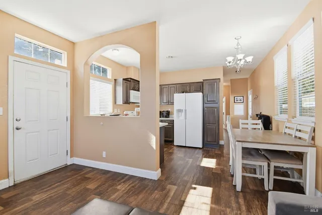 a view of a kitchen from the hallway