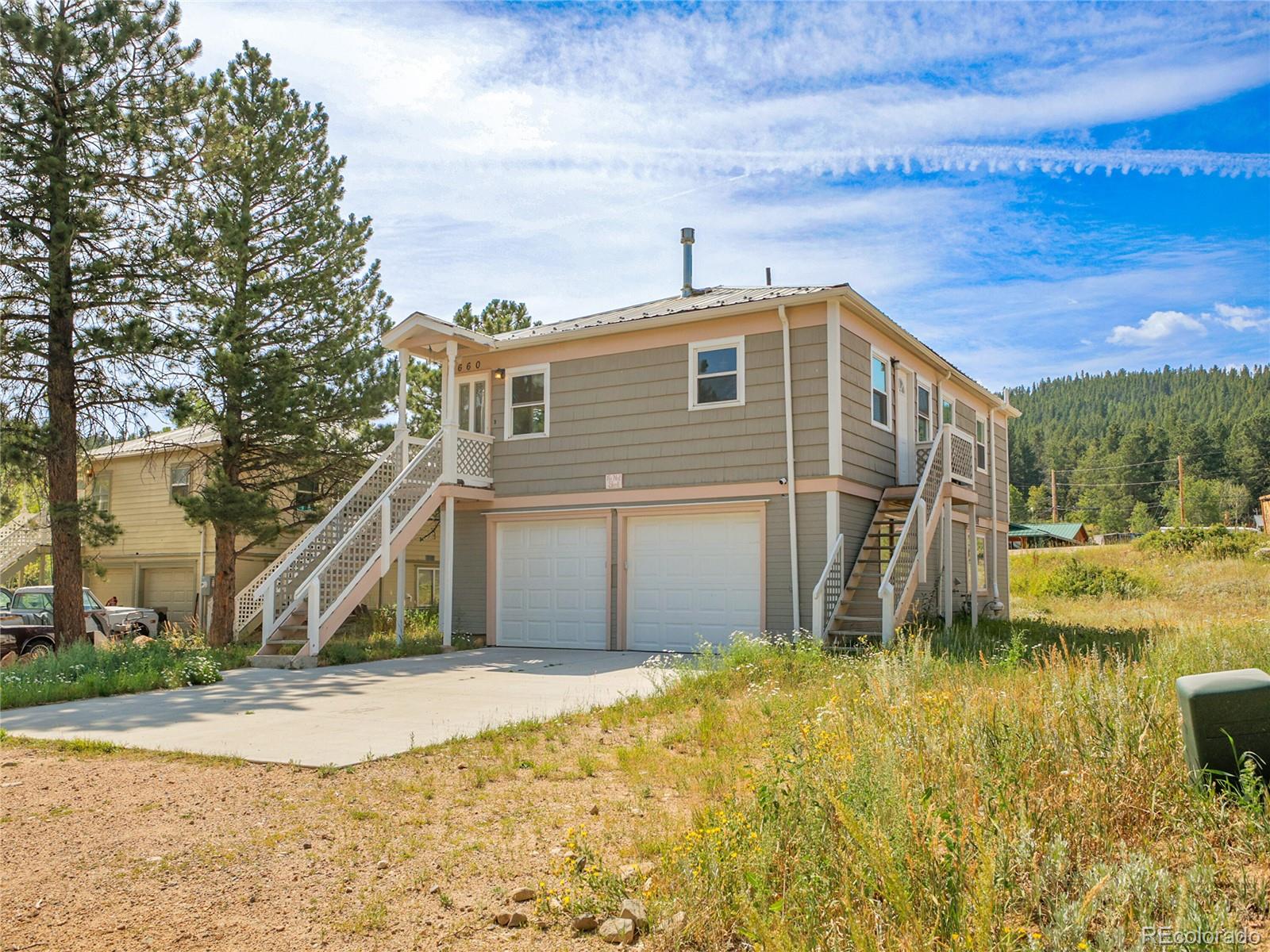 660 West Spruce Street Nederland, CO 80466 - Photo 1 of 29 a front view of a house with a yard