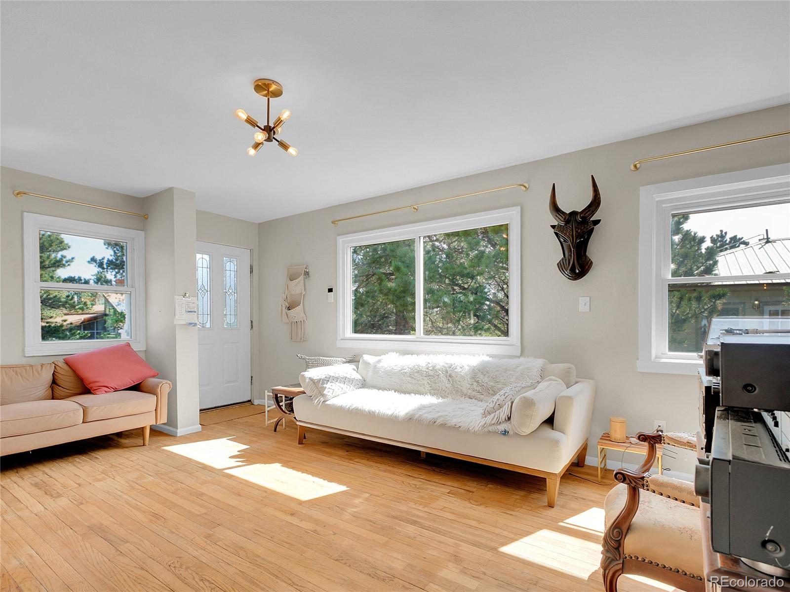 660 West Spruce Street Nederland, CO 80466 - Photo 11 of 29 a bedroom with a bed and wooden floor