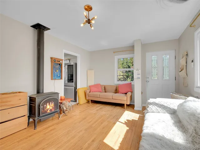 a bedroom with furniture and a wooden floor