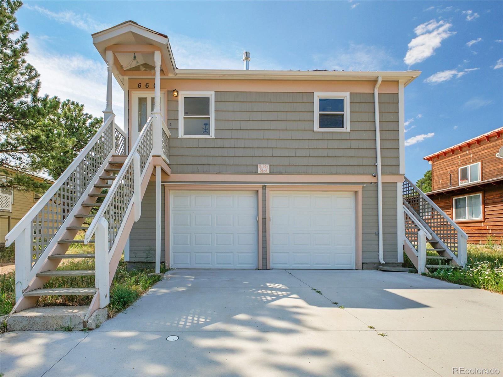 660 West Spruce Street Nederland, CO 80466 - Photo 2 of 29 a front view of a house with a yard