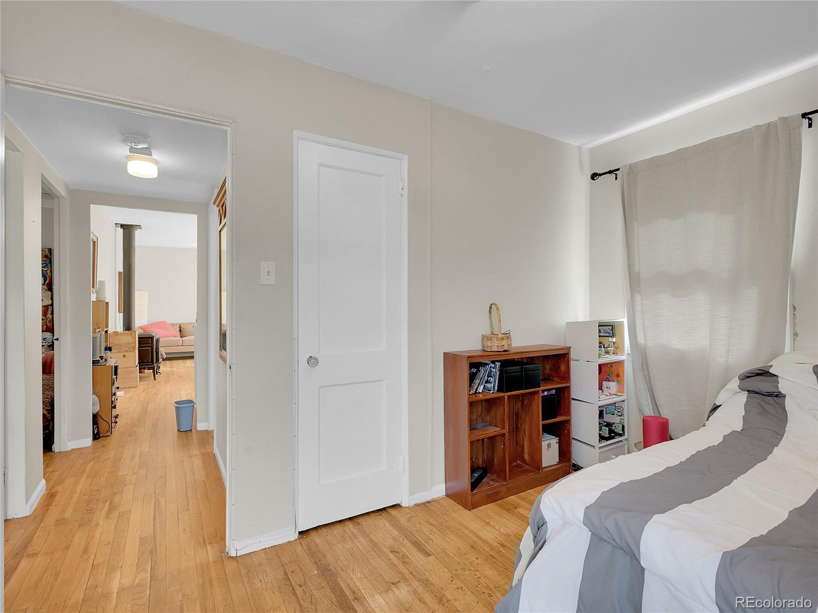 660 West Spruce Street Nederland, CO 80466 - Photo 27 of 29 a bed room with a bed and a walk in closet