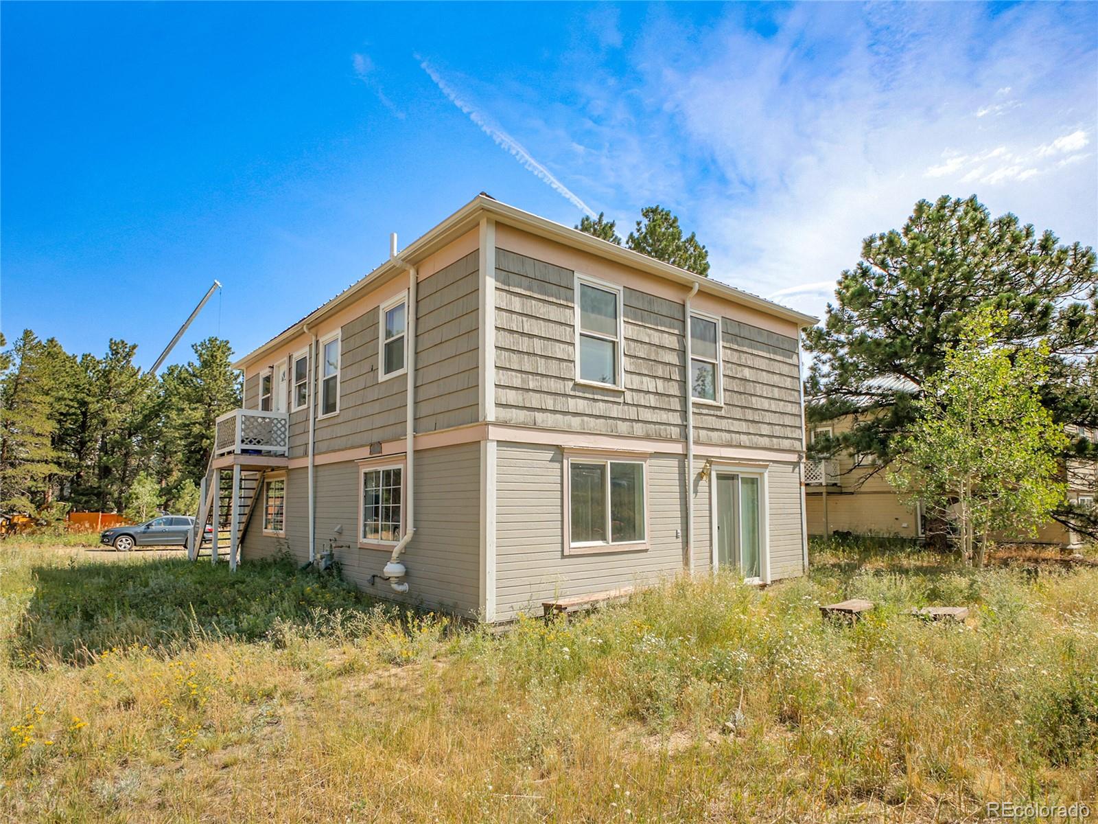 660 West Spruce Street Nederland, CO 80466 - Photo 28 of 29 a front view of a house with a yard