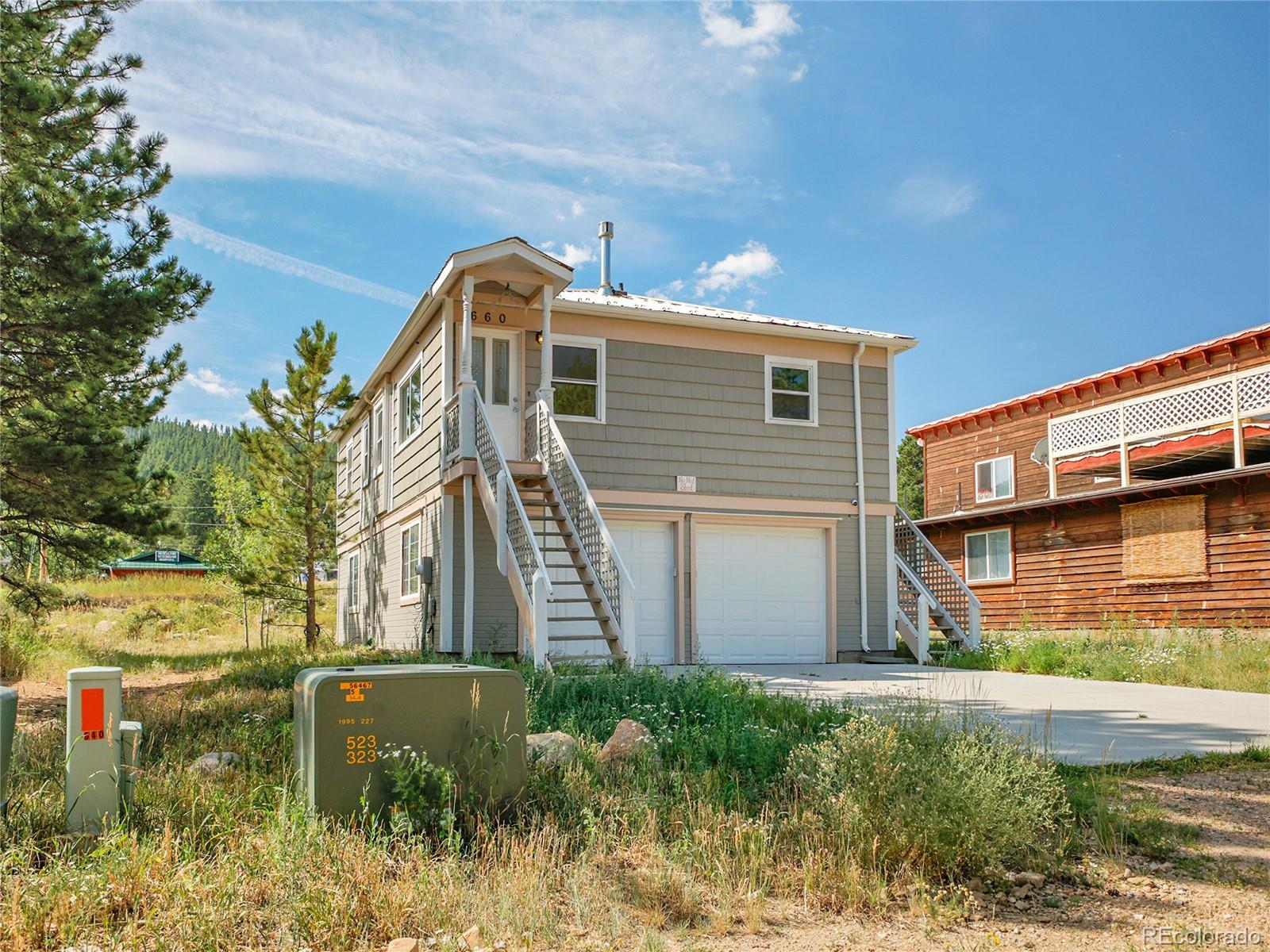 660 West Spruce Street Nederland, CO 80466 - Photo 5 of 29 a front view of a house with a yard