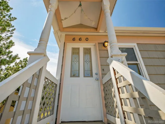 a front view of a house with a blue park