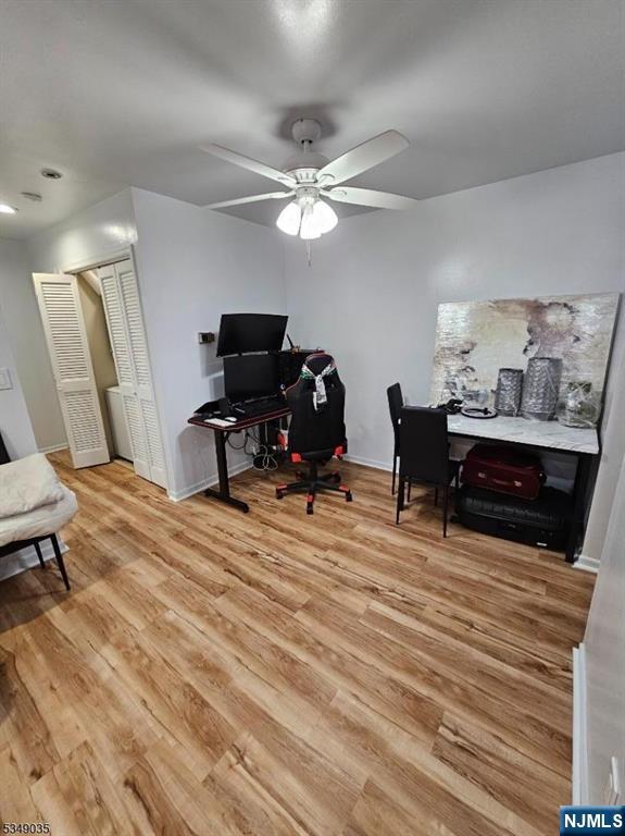 120 Sherwood Avenue, Unit 102 Paterson, NJ 07502 - Photo 8 of 13 a bed room with a bed and a chandelier