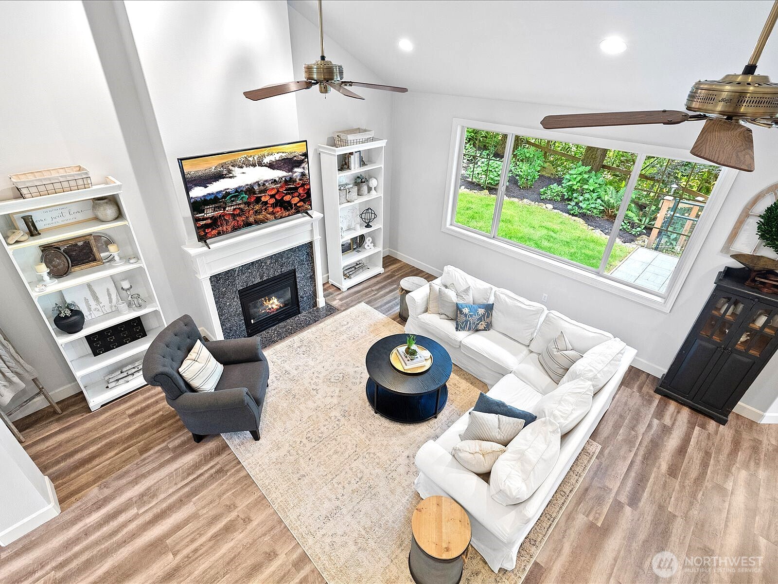33606 Northeast Lake Joy Road Carnation, WA 98014 - Photo 27 of 40 a living room with furniture and a fireplace