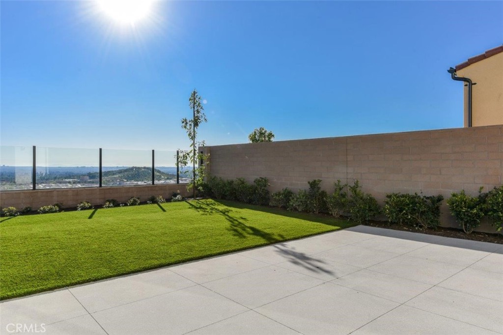 102 Winnett Irvine, CA 92602 - Photo 2 of 9 a view of a garden with a building in the background
