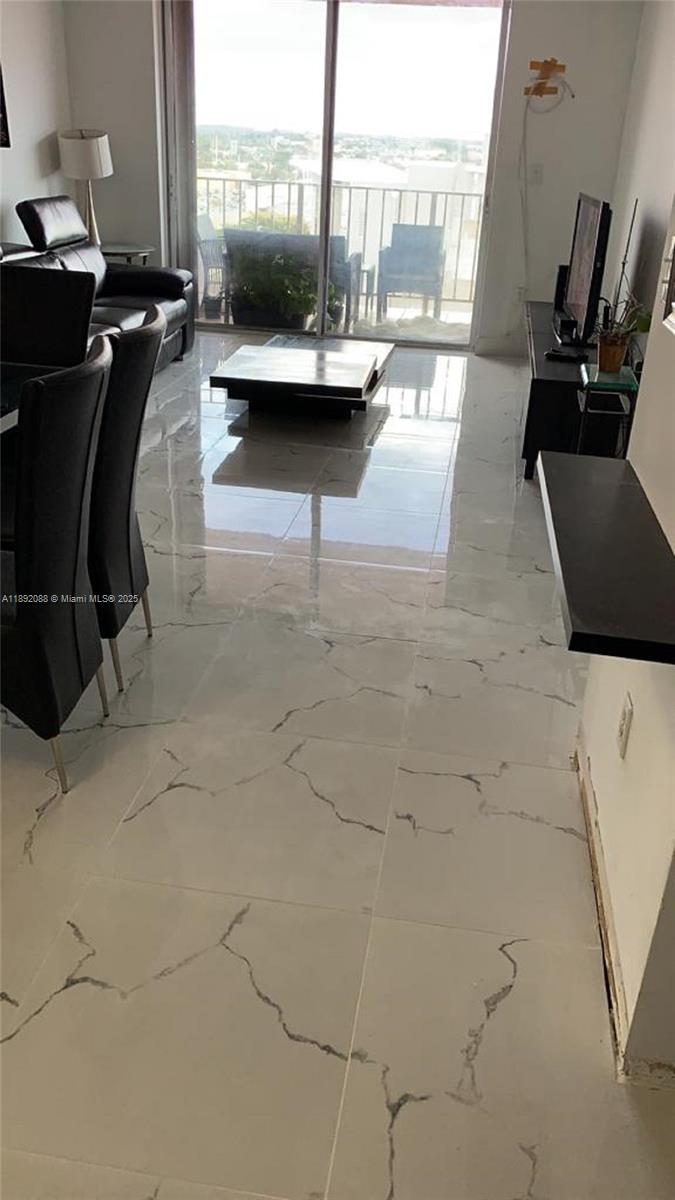 4675 West 18th Court, Unit 1011 Hialeah, FL 33012 - Photo 2 of 16 a view of a terrace with seating space