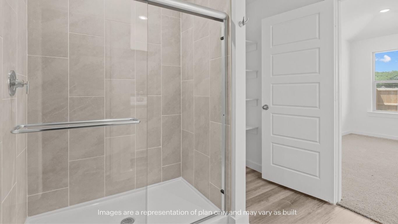 7411 9th Street Lubbock, TX 79416 - Photo 12 of 20 a bathroom with a shower