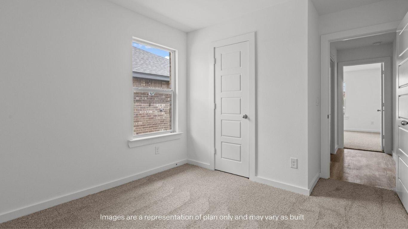 7411 9th Street Lubbock, TX 79416 - Photo 16 of 20 a view of an empty room with closet and a window