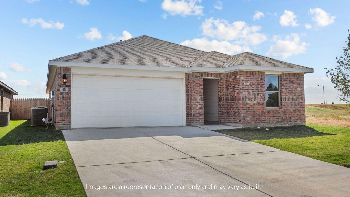 7411 9th Street Lubbock, TX 79416 - Photo 2 of 20 a front view of a house with a garden